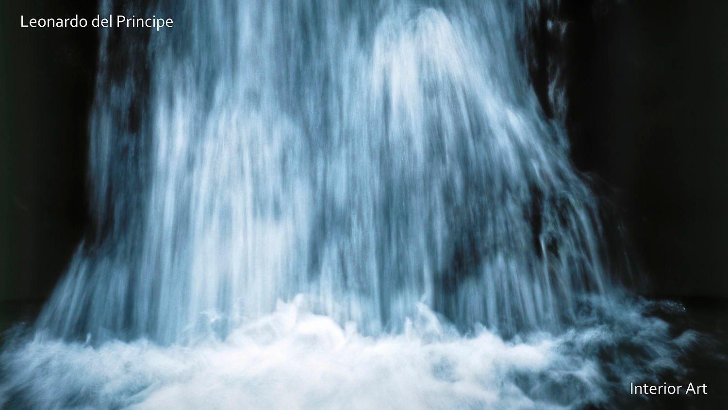 KOSA01 A dynamic waterfall cascades down with mist at the base. The image conveys motion and tranquility, featuring soft blue and white tones.