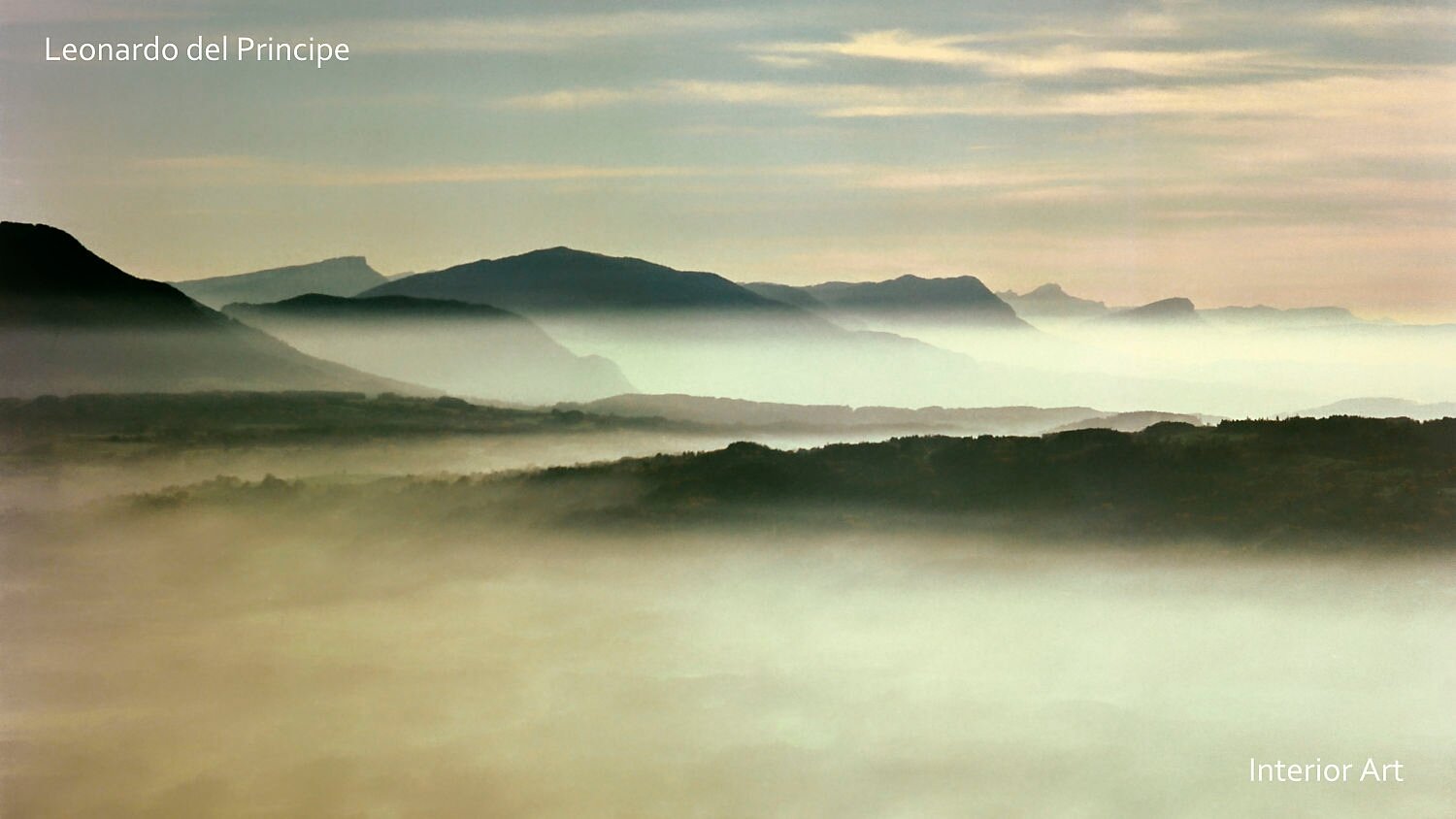 SDLK01 Misty mountain landscape at dawn, with soft layers of fog enveloping rolling hills. The scene evokes tranquility and a sense of calm serenity.