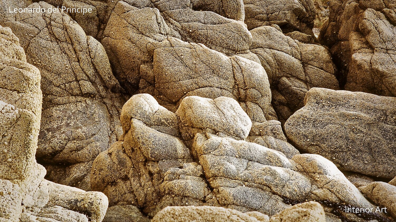 SMPC03 Close-up of rugged, textured rocks with earthy tones, conveying a natural, serene atmosphere. The irregular patterns evoke a sense of timelessness